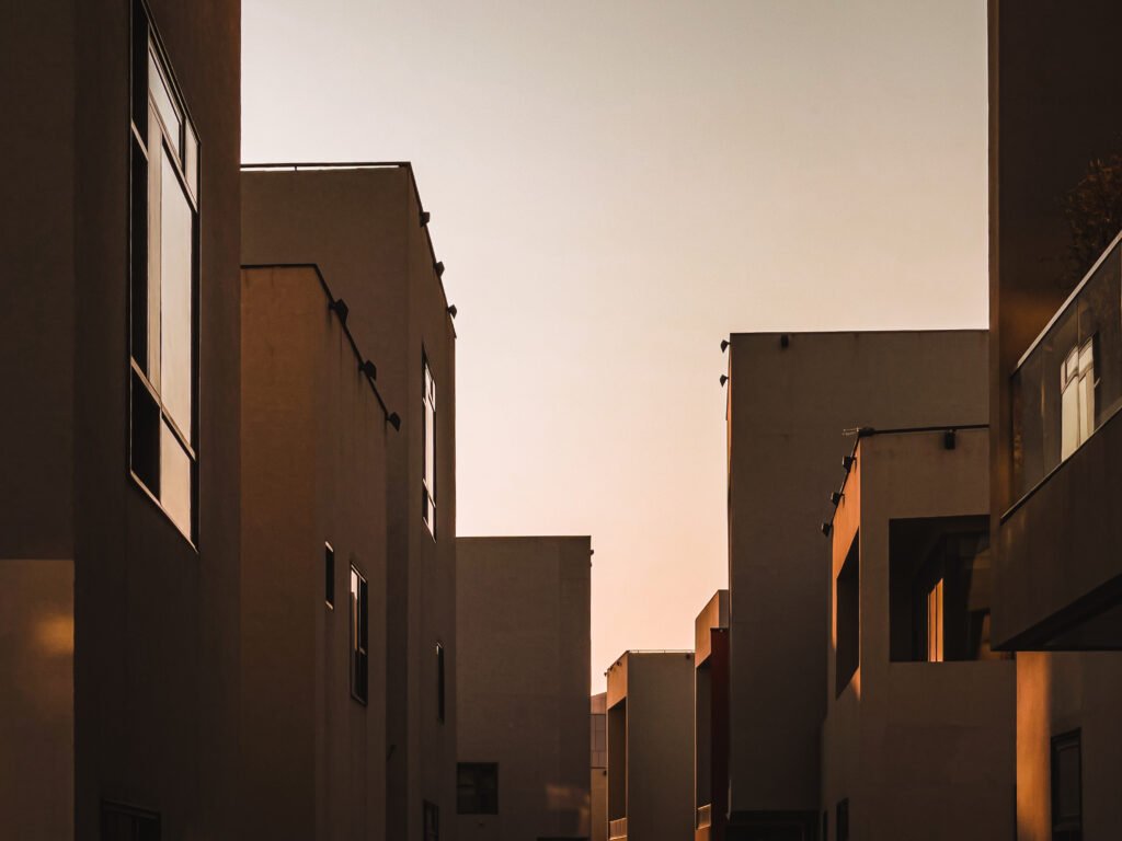 Modern architectural details of buildings partly lit by the sunlight